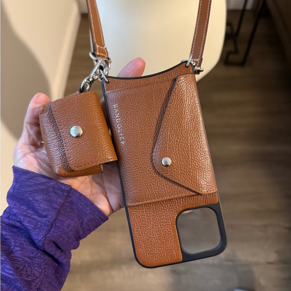 Bandolier Brown Leather Phone Case with Strap with Airpod case.
